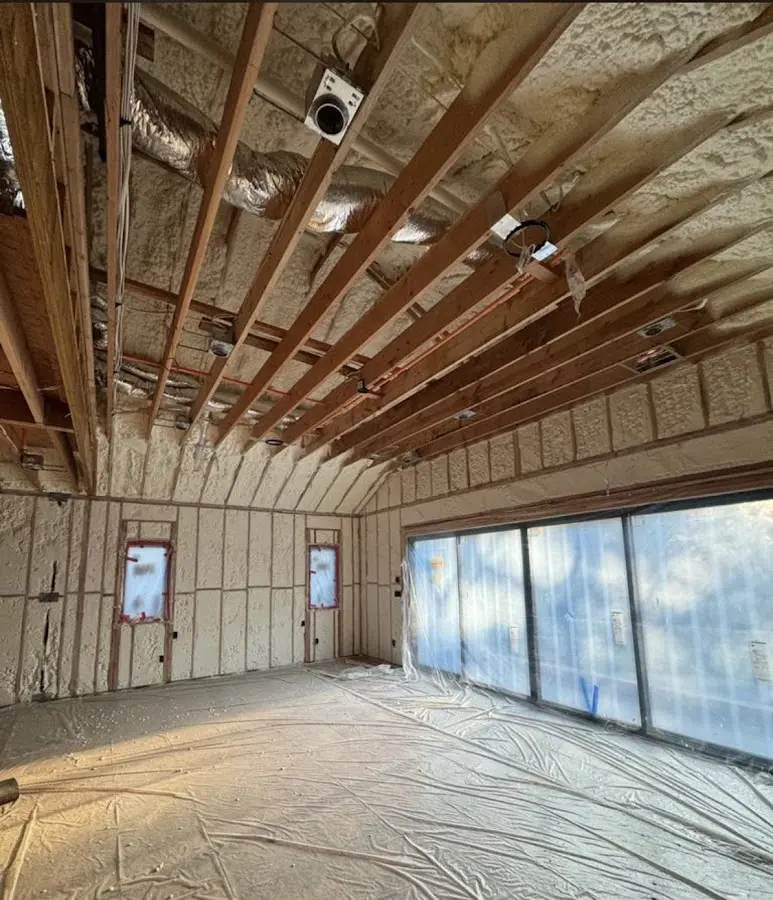 Interior walls and ceiling insulated with spray foam during new construction in Mills River